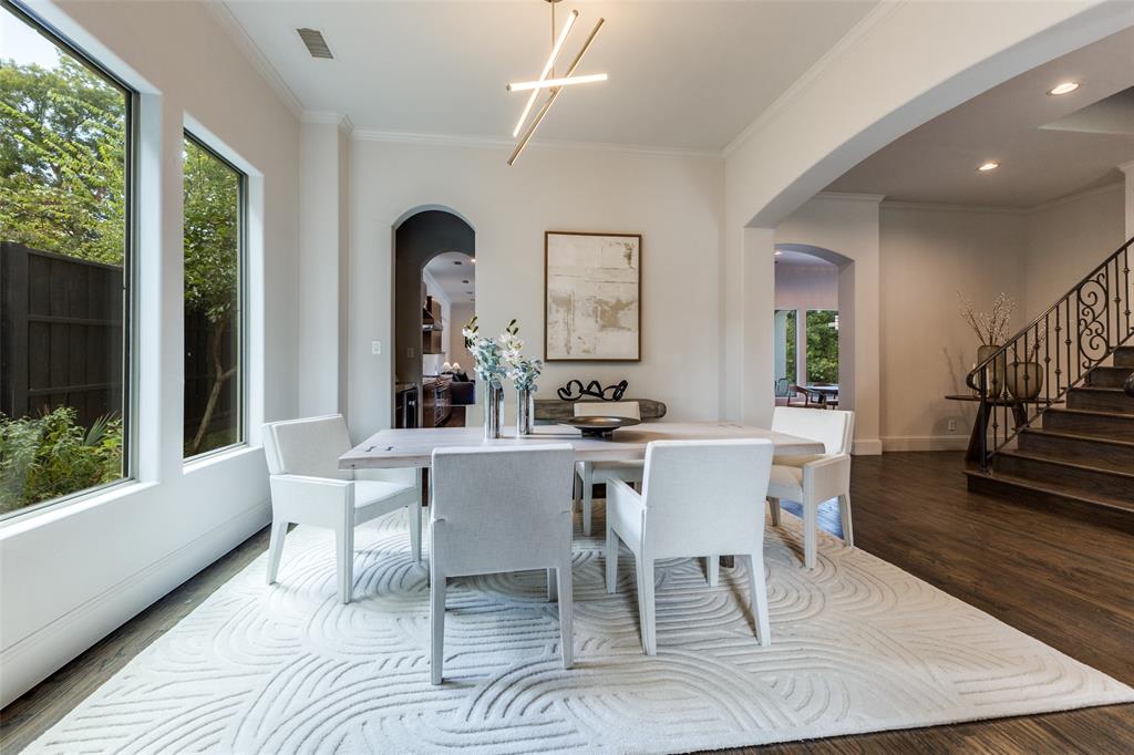 8647 Wingate Drive Dallas, TX 75209 - Photo 3 of 27 a dining room with wooden floor and a large window