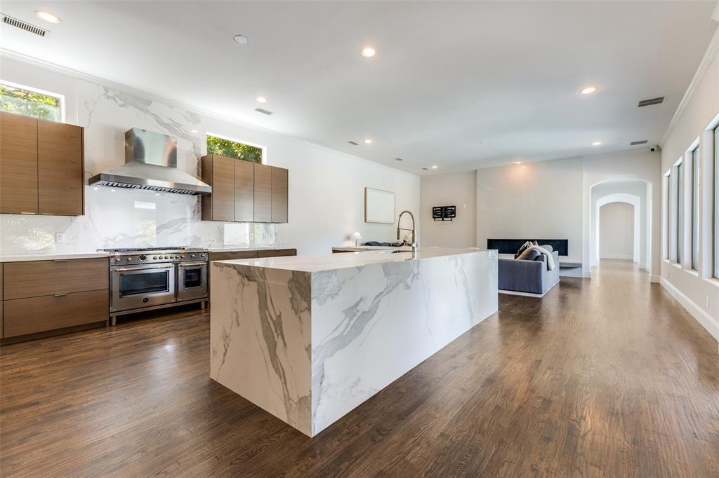 8647 Wingate Drive Dallas, TX 75209 - Photo 7 of 27 a large white kitchen with stainless steel appliances
