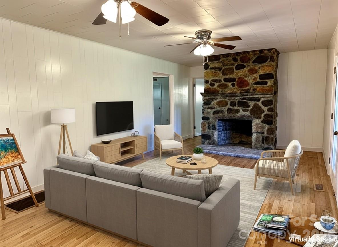 208 Murdock Road Bakersville, NC 28705 - Photo 12 of 46 a living room with furniture and a fireplace