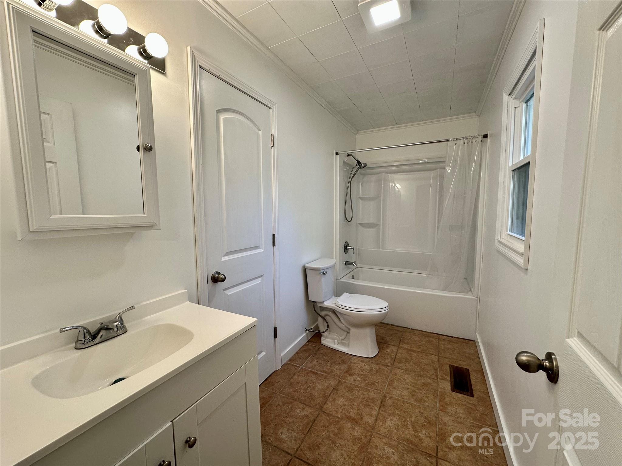 208 Murdock Road Bakersville, NC 28705 - Photo 17 of 32 a bathroom with a sink toilet and shower