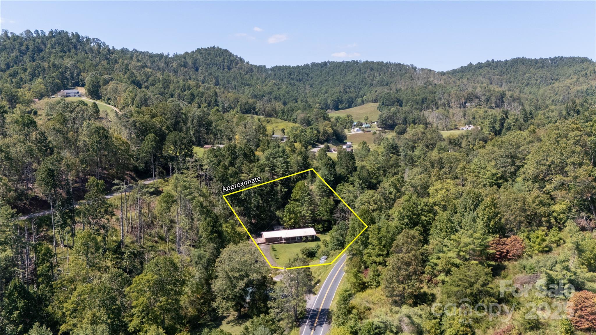 208 Murdock Road Bakersville, NC 28705 - Photo 24 of 32 an aerial view of a house with a yard