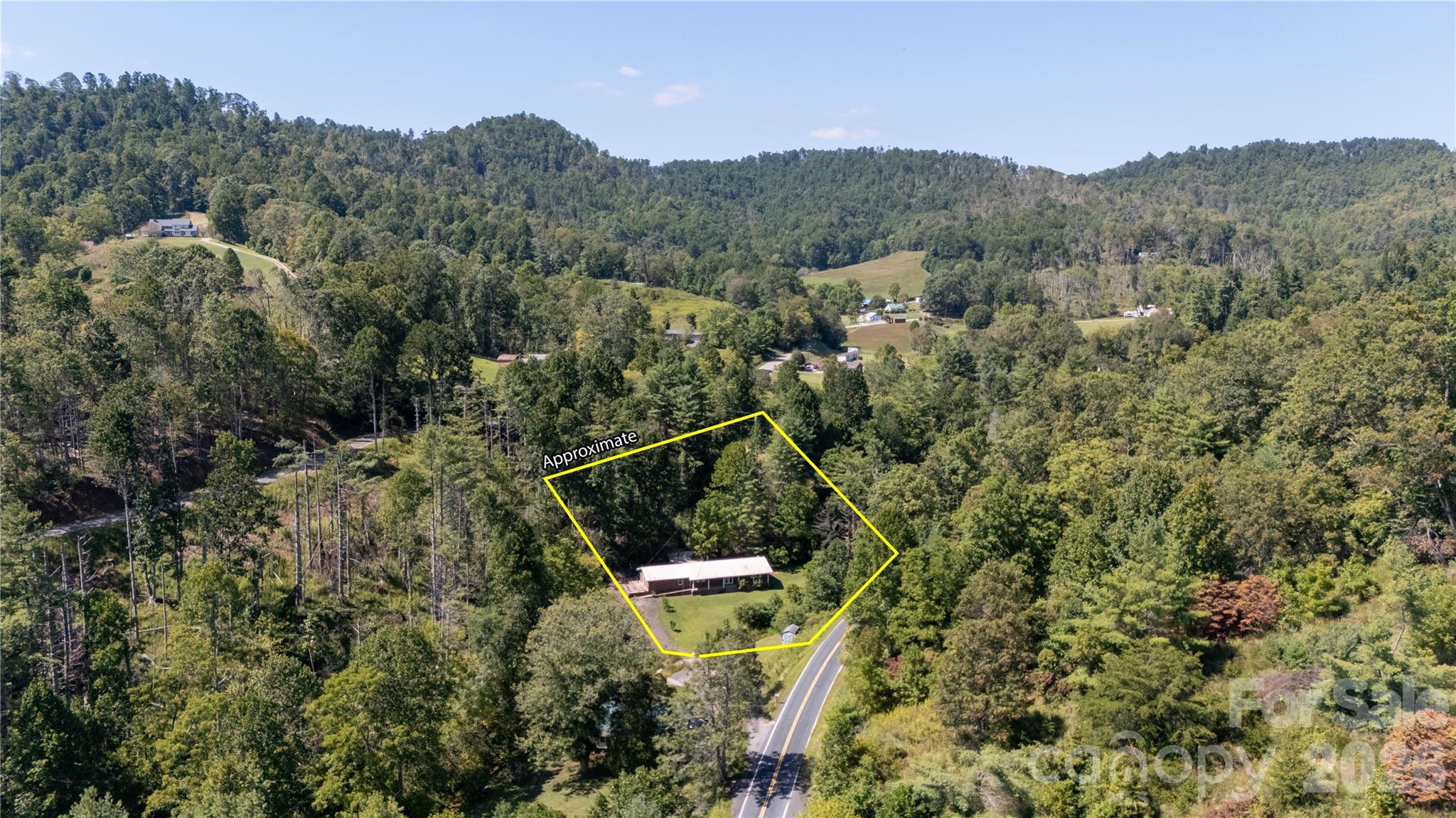 208 Murdock Road Bakersville, NC 28705 - Photo 35 of 46 an aerial view of a house with a yard