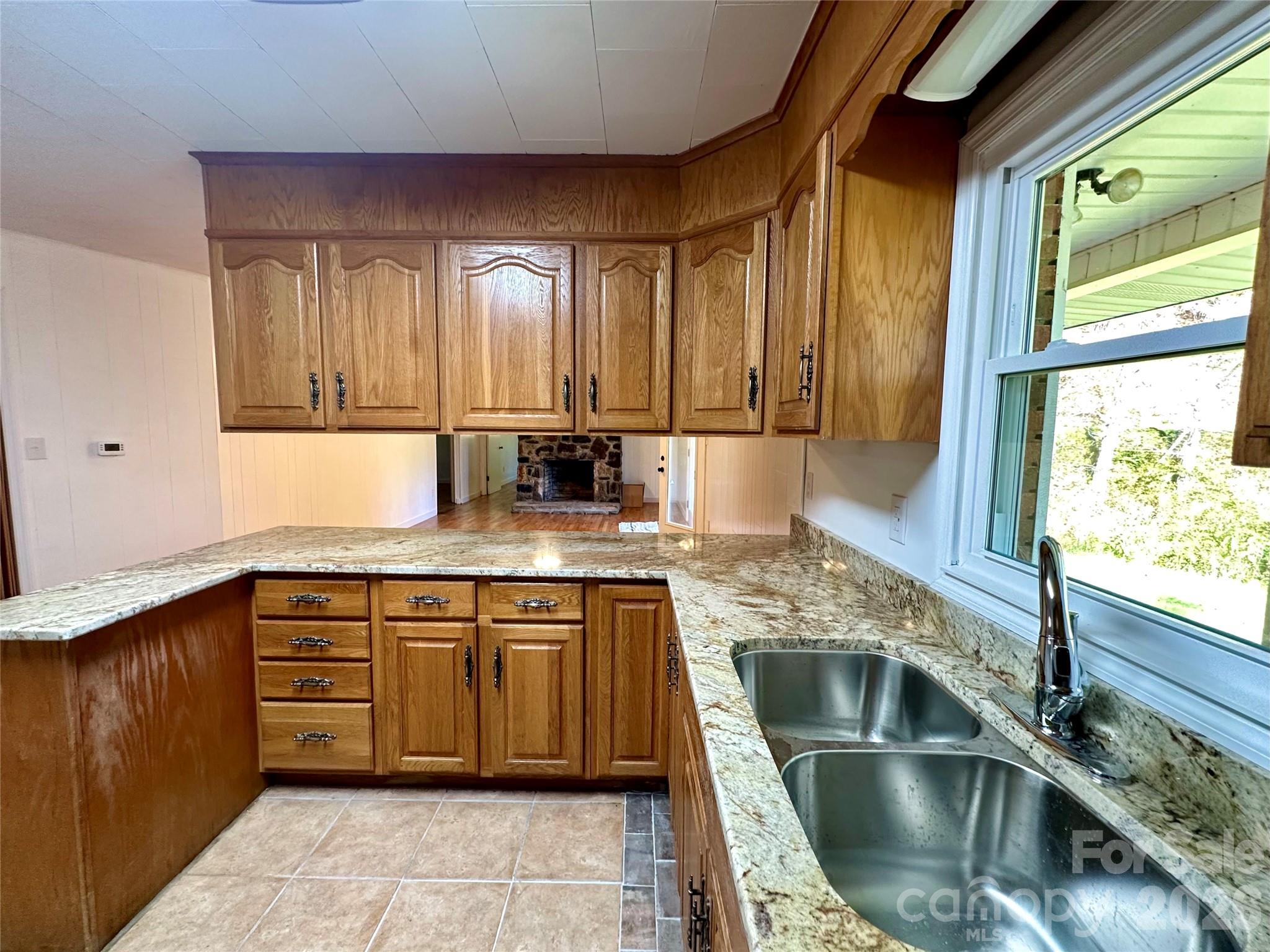 208 Murdock Road Bakersville, NC 28705 - Photo 8 of 46 a kitchen with stainless steel appliances granite countertop a sink stove and cabinets