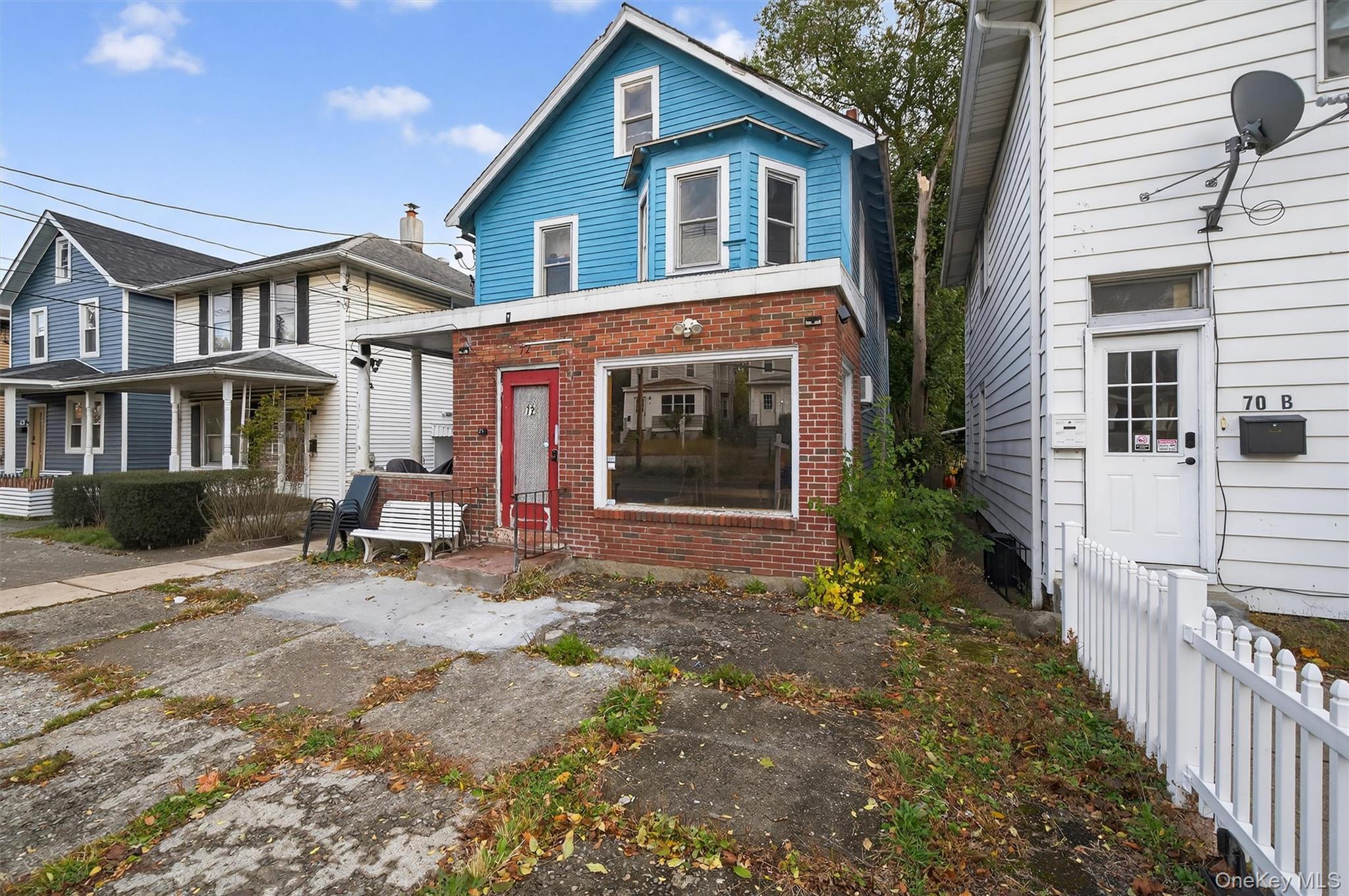 72 Wisner Avenue Newburgh, NY 12550 - Photo 3 of 19 a front view of a house with garden
