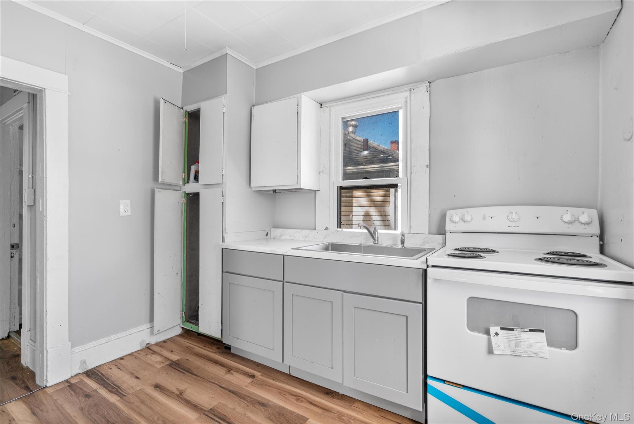 72 Wisner Avenue Newburgh, NY 12550 - Photo 8 of 19 a view of kitchen with wooden floor washer and dryer