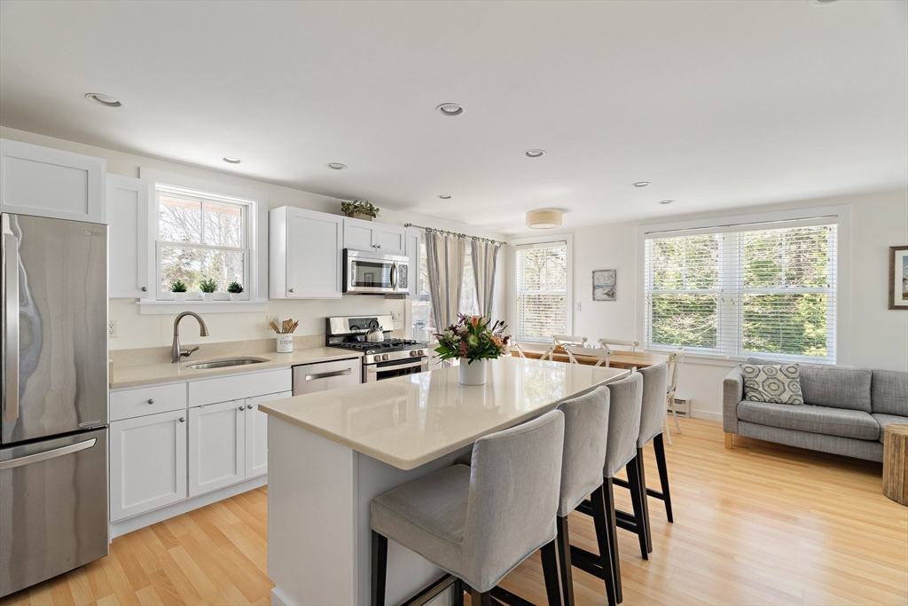 13 Young Street Edgartown, MA 02539 - Photo 2 of 29 a kitchen with center island and stainless steel appliances