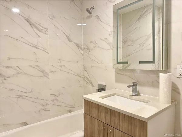 a bathroom with a sink and a bathtub