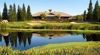 345 Hawk Ridge Copperopolis, CA 95228 - Photo 3 of 5 a view of a lake with a house in the background