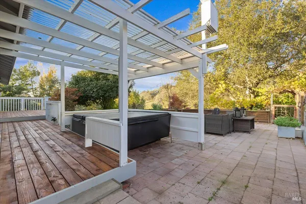 a view of a patio with a table and chairs