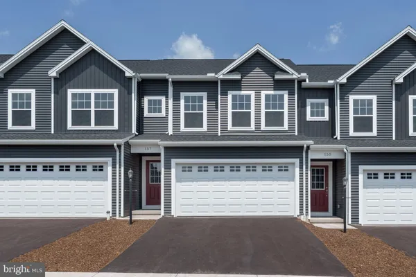 a front view of a house with a garage