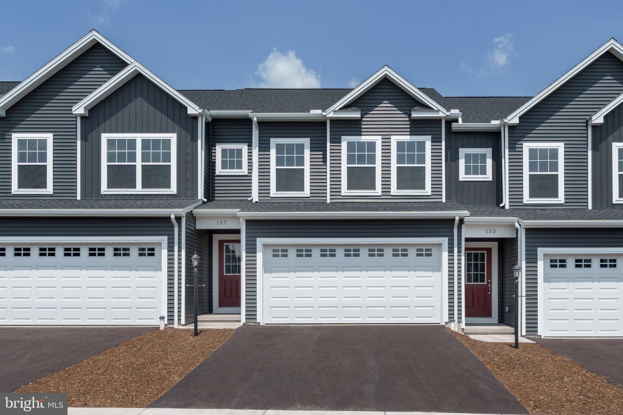 a front view of a house with a garage