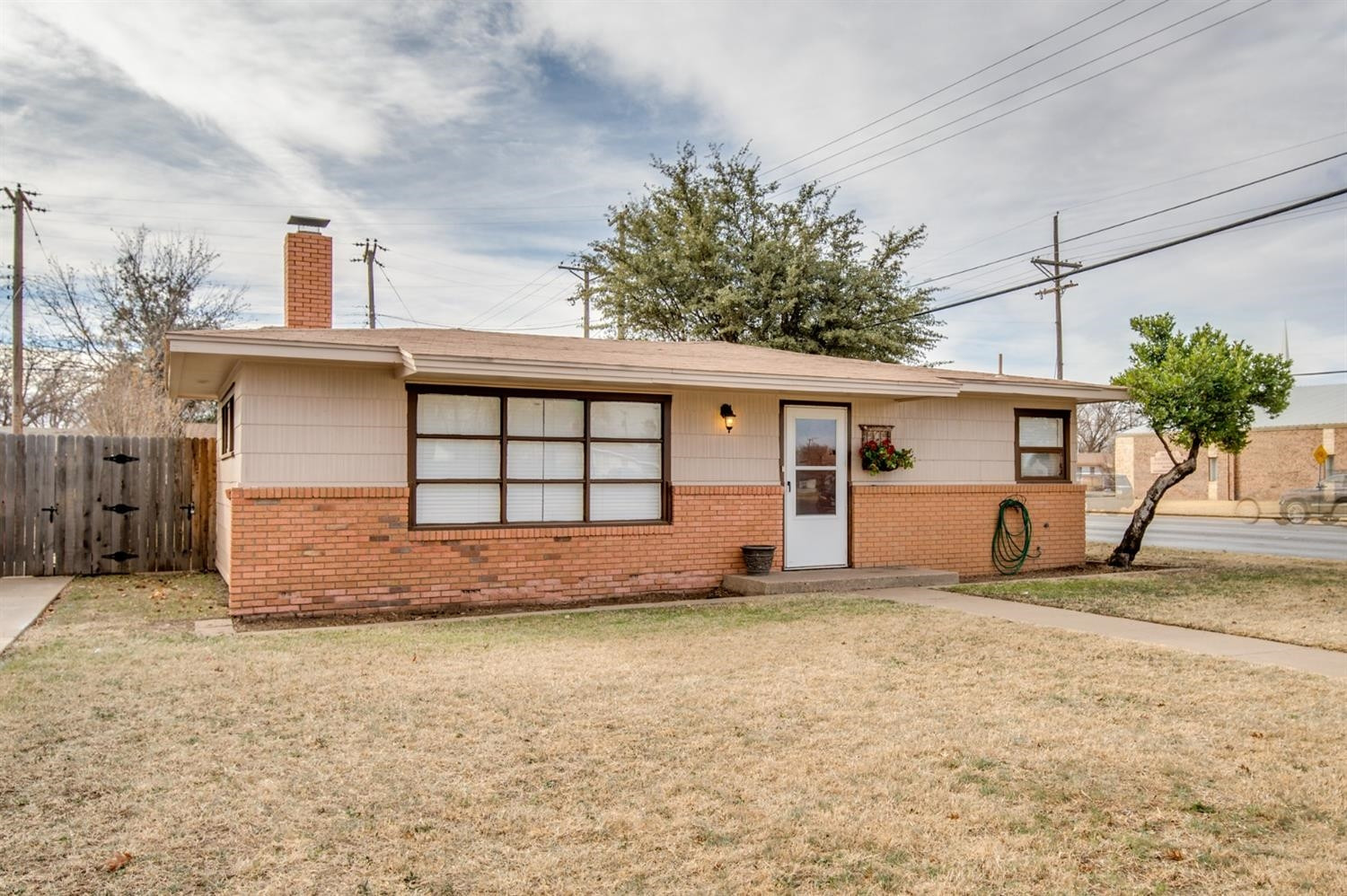 4319 40th Street Lubbock, TX 79413 - Photo 2 of 10 a view of a house with a yard and garage