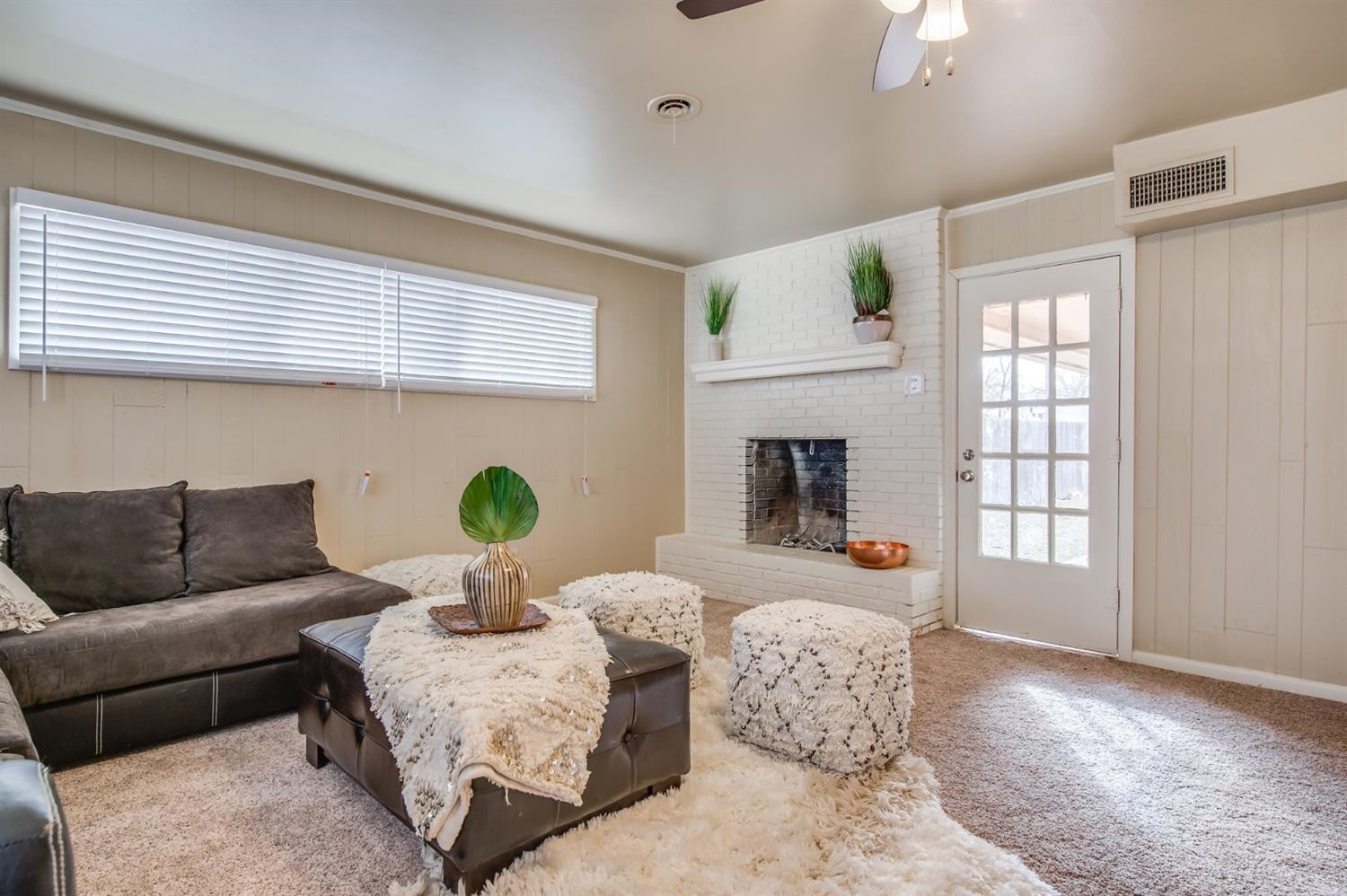 4319 40th Street Lubbock, TX 79413 - Photo 3 of 10 a living room with furniture flowerpot and wooden floor
