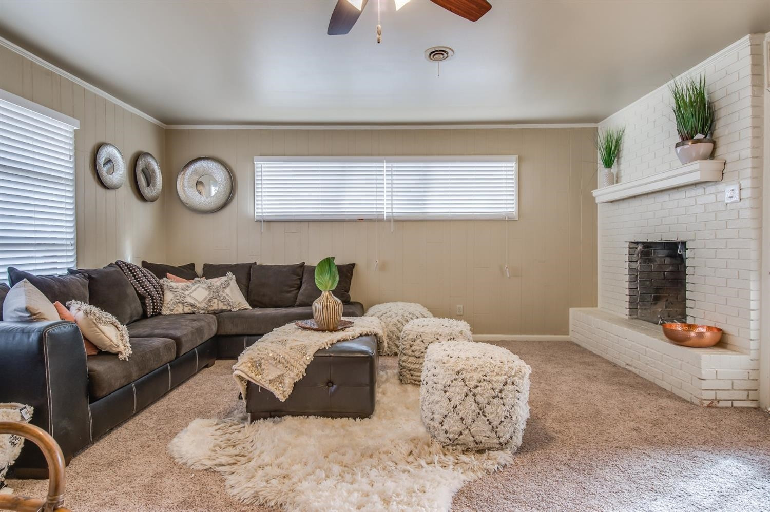 4319 40th Street Lubbock, TX 79413 - Photo 4 of 10 a bedroom with a bed and a chandelier