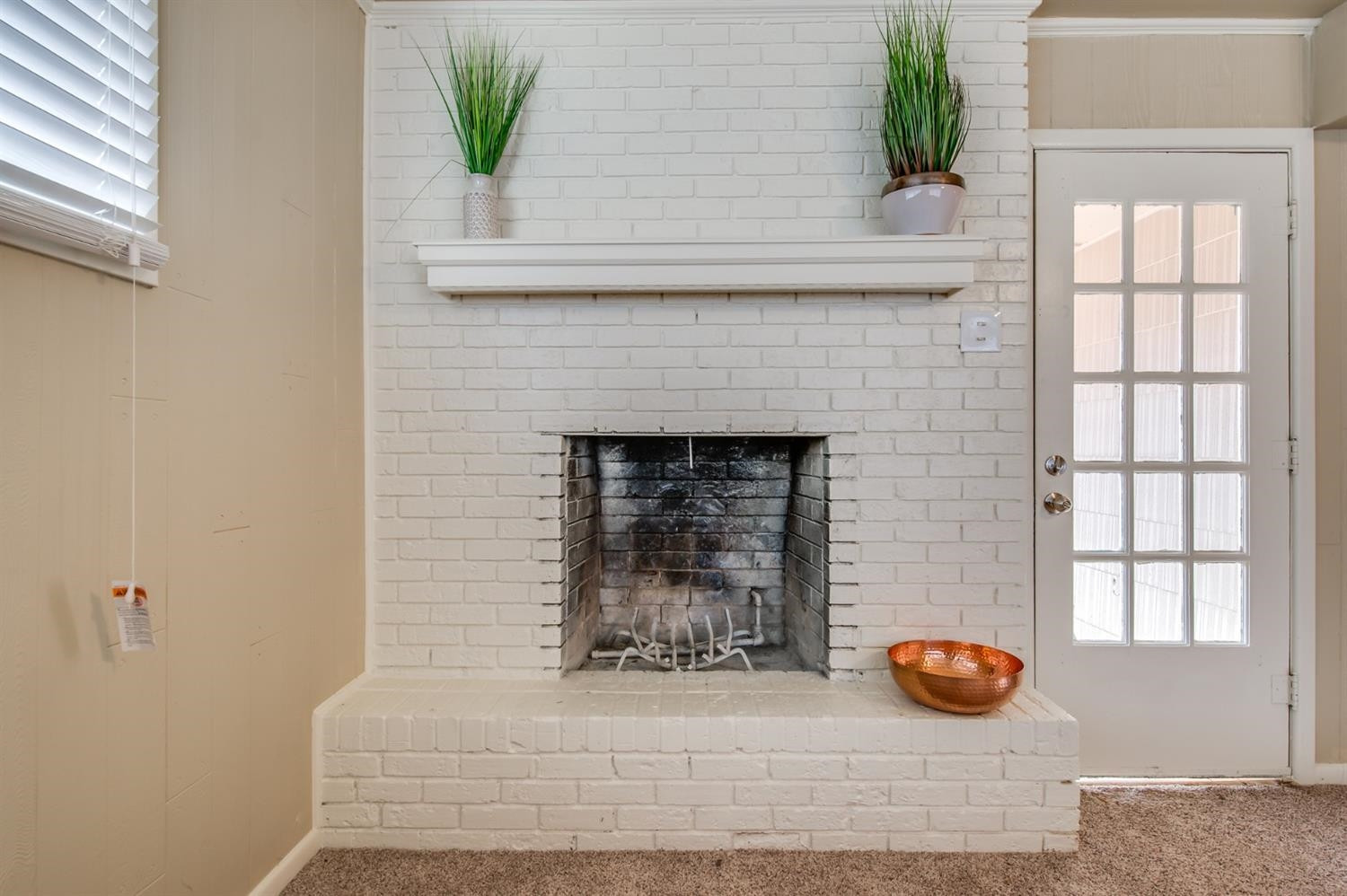 4319 40th Street Lubbock, TX 79413 - Photo 6 of 10 wooden floor with a fireplace