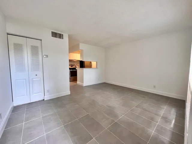a view of a livingroom with an empty space and window