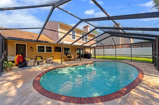 a view of a swimming pool with a patio
