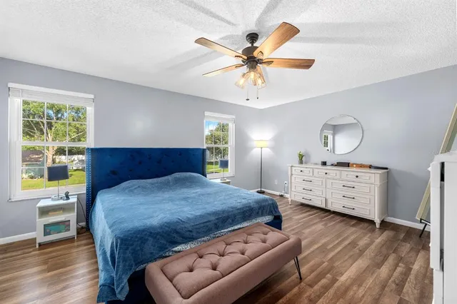 a bed room with a bed and a chandelier