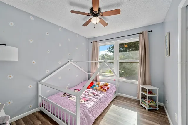 a bedroom with furniture and a window