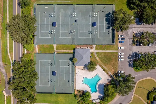 an aerial view of a house with swimming pool