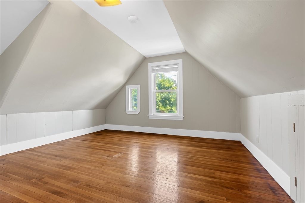 28 Evergreen Street, Unit 3 Boston, MA 02130 - Photo 13 of 16 an empty room with wooden floor and windows