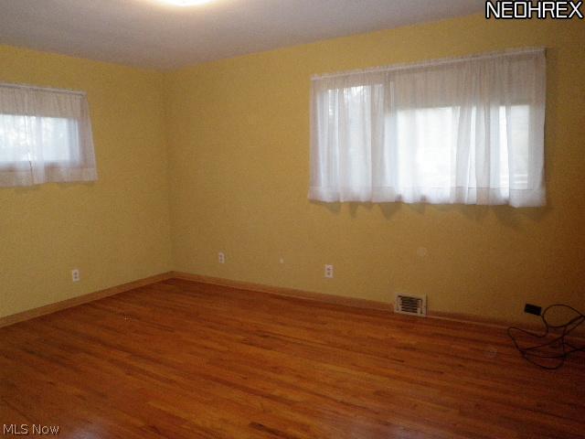 1025 Hanley Road Cleveland, OH 44124 - Photo 7 of 11 Master bedroom newly painted with pretty hardwood floors
