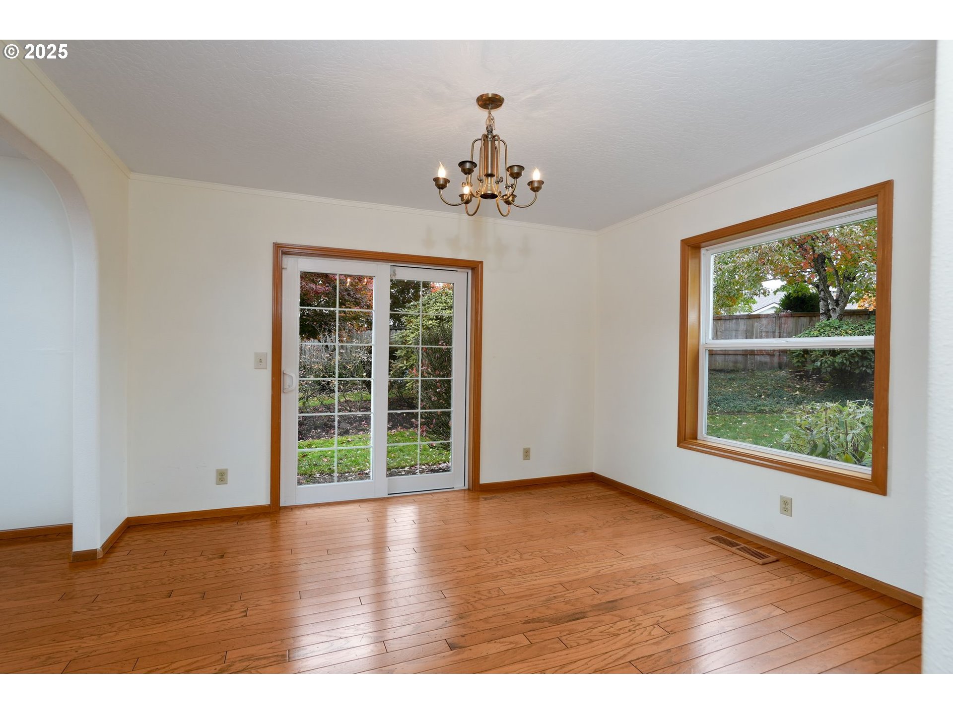 503 Southwest Mistmaiden Court Sublimity, OR 97385 - Photo 13 of 47 an empty room with wooden floor and windows