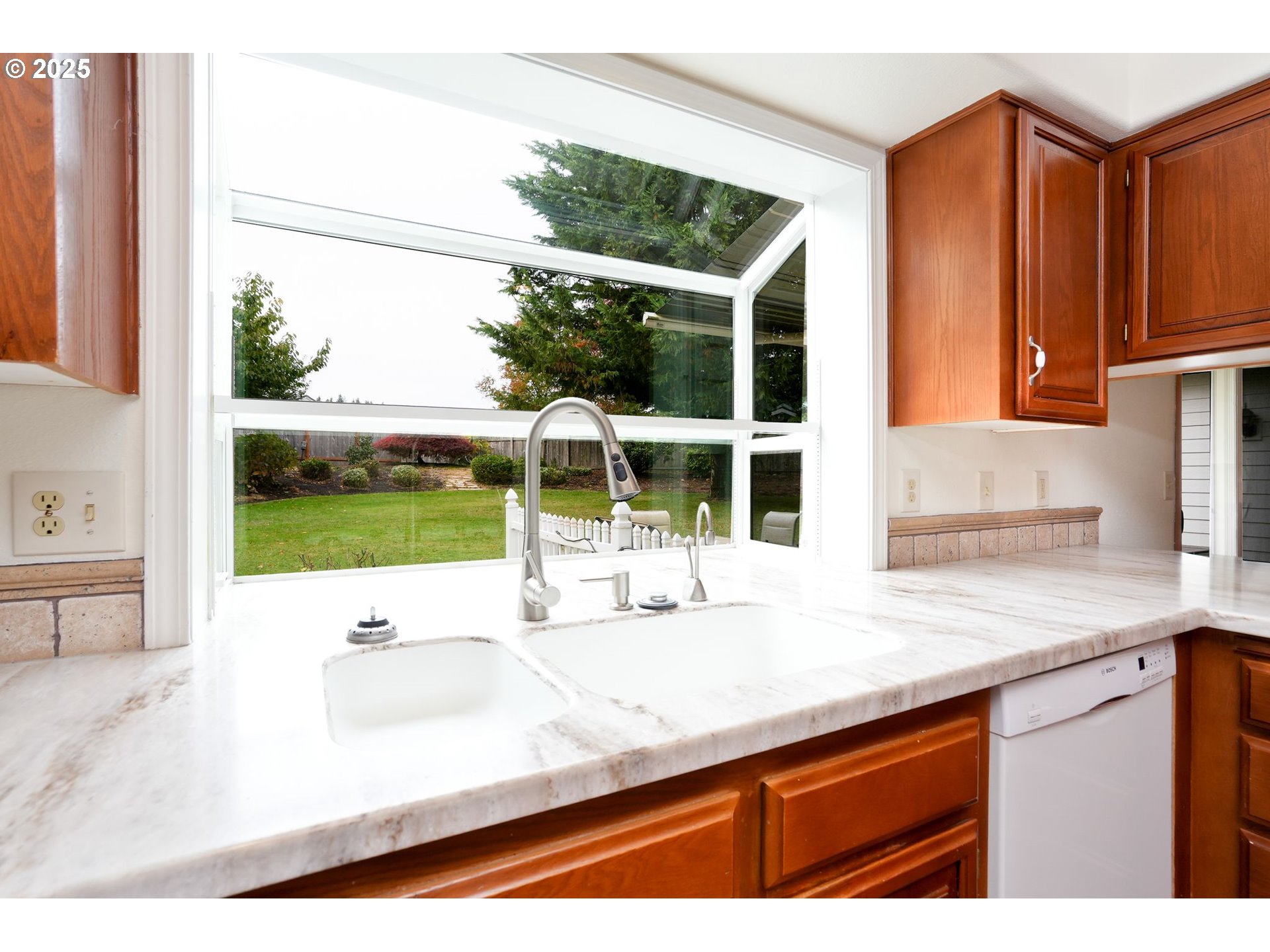 503 Southwest Mistmaiden Court Sublimity, OR 97385 - Photo 16 of 47 a kitchen with a sink and a large window