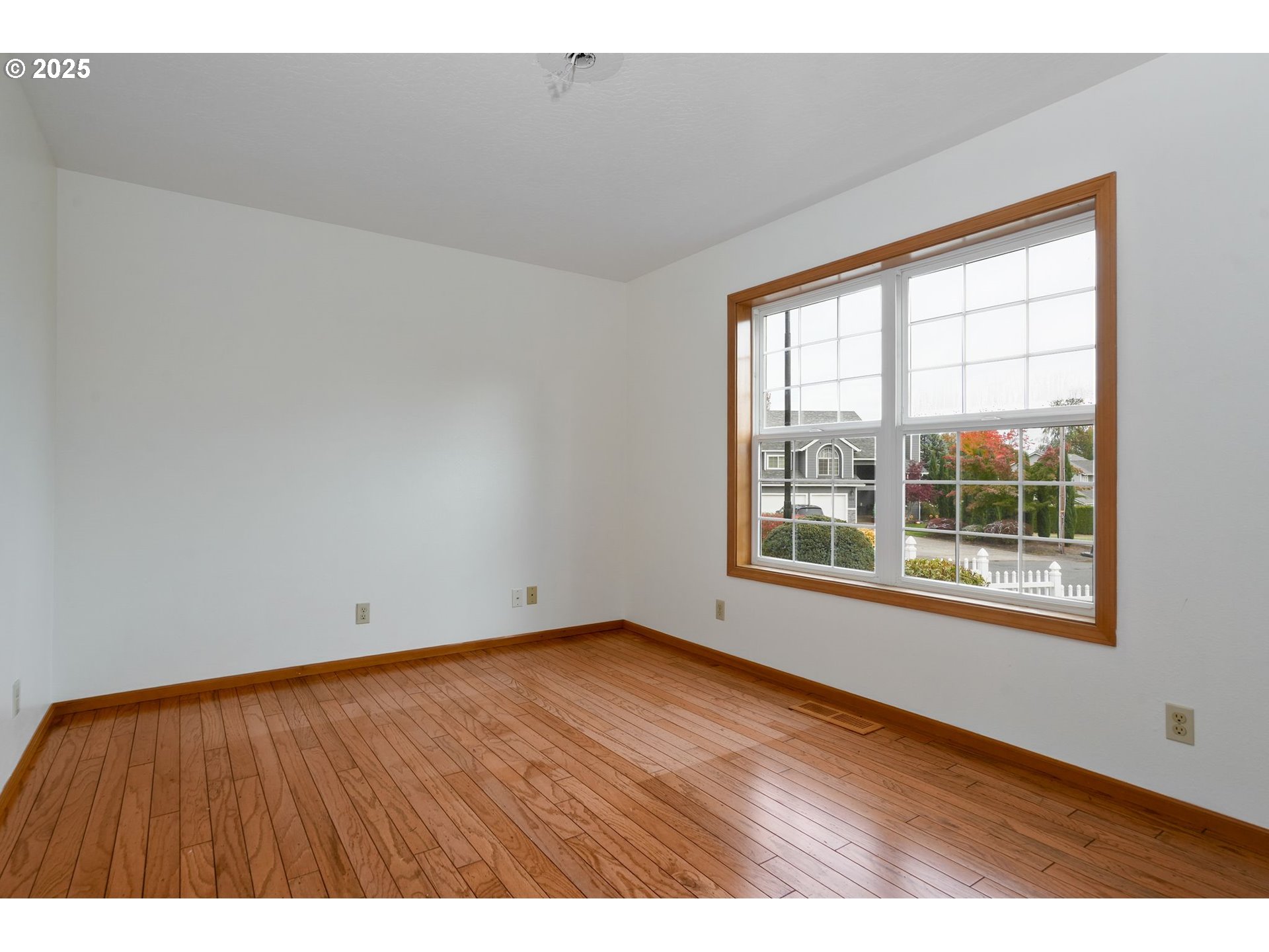 503 Southwest Mistmaiden Court Sublimity, OR 97385 - Photo 24 of 47 an empty room with wooden floor and windows