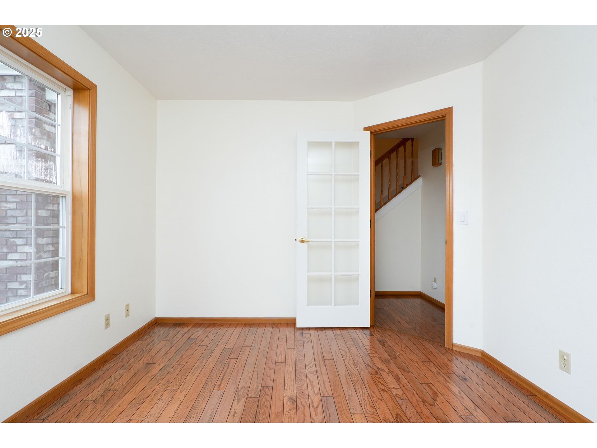503 Southwest Mistmaiden Court Sublimity, OR 97385 - Photo 25 of 47 a view of an empty room with wooden floor and a window