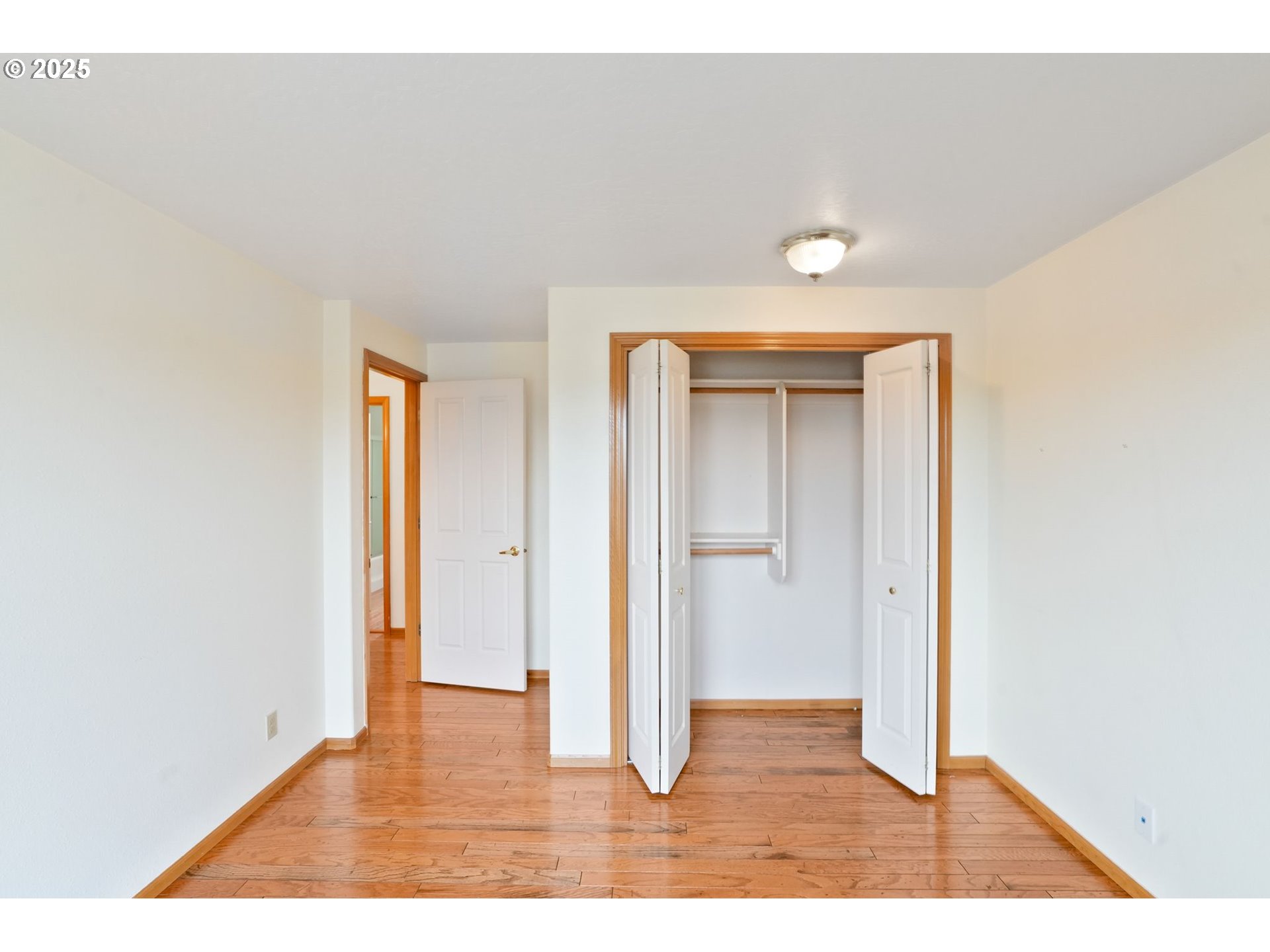 503 Southwest Mistmaiden Court Sublimity, OR 97385 - Photo 29 of 47 a view of an empty room with wooden floor