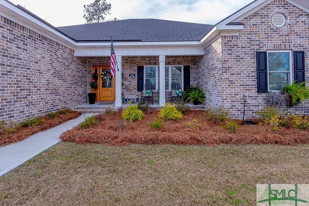 202 Lennox Place Rincon, GA 31326 - Photo 3 of 47 Lush landscaping with irrigation system.
