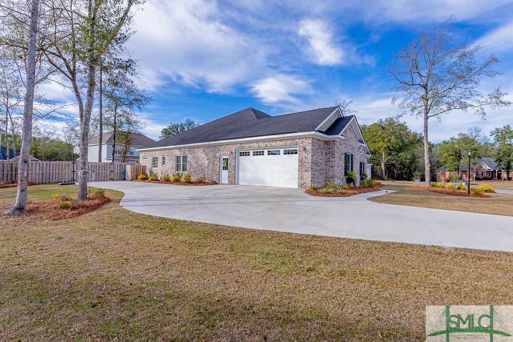 202 Lennox Place Rincon, GA 31326 - Photo 45 of 47 Extra wide drive with exterior door and two car, s