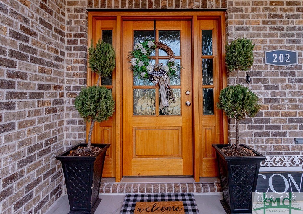 202 Lennox Place Rincon, GA 31326 - Photo 6 of 47 Picture perfect entry, with solid wood door and do