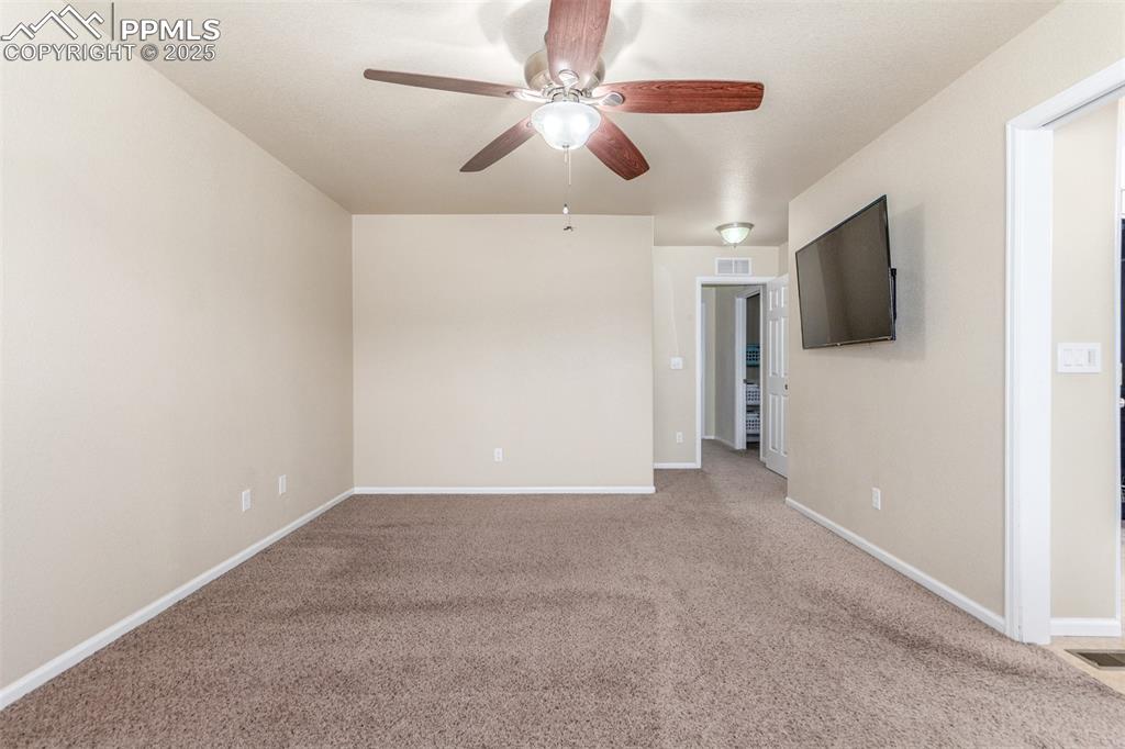 7750 Dutch Loop Colorado Springs, CO 80925 - Photo 14 of 50 a view of an empty room with a ceiling fan