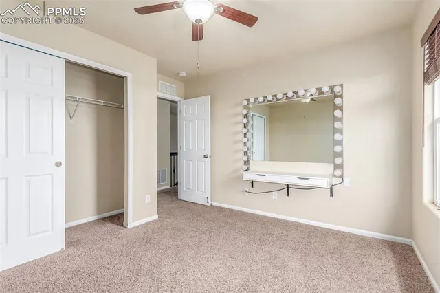 a view of a livingroom with a cabinet and chandelier