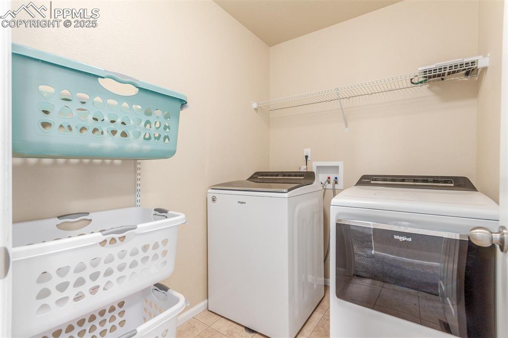 7750 Dutch Loop Colorado Springs, CO 80925 - Photo 34 of 50 a utility room with dryer and washer