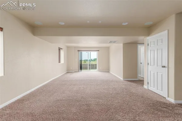 a view of empty room with windows