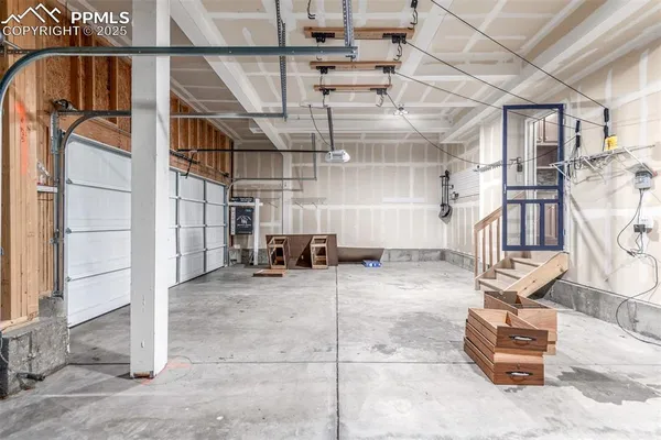 a view of an empty room with a staircase