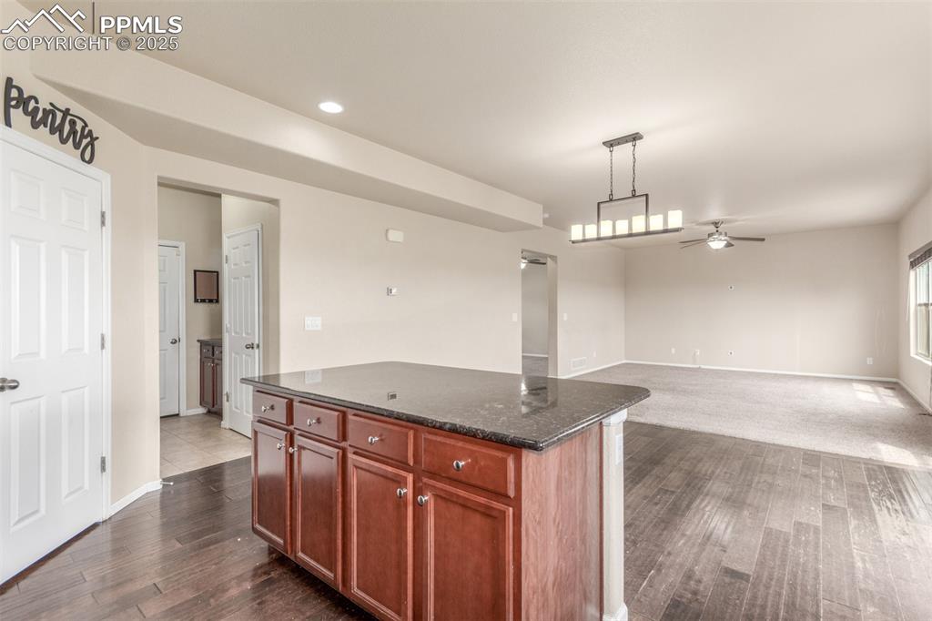 7750 Dutch Loop Colorado Springs, CO 80925 - Photo 7 of 50 a view of a kitchen with a sink and chandelier
