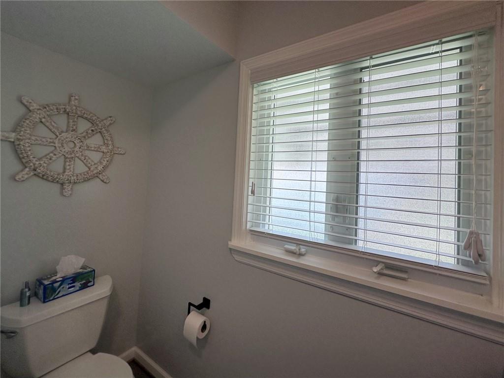 1804 River Road North Apollo, PA 15673 - Photo 34 of 39 a bathroom with a window a toilet and a window