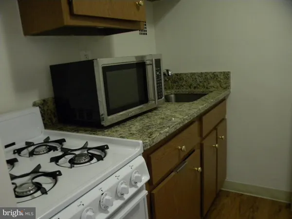 a kitchen with a stove and a microwave