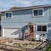 a front view of a house with yard