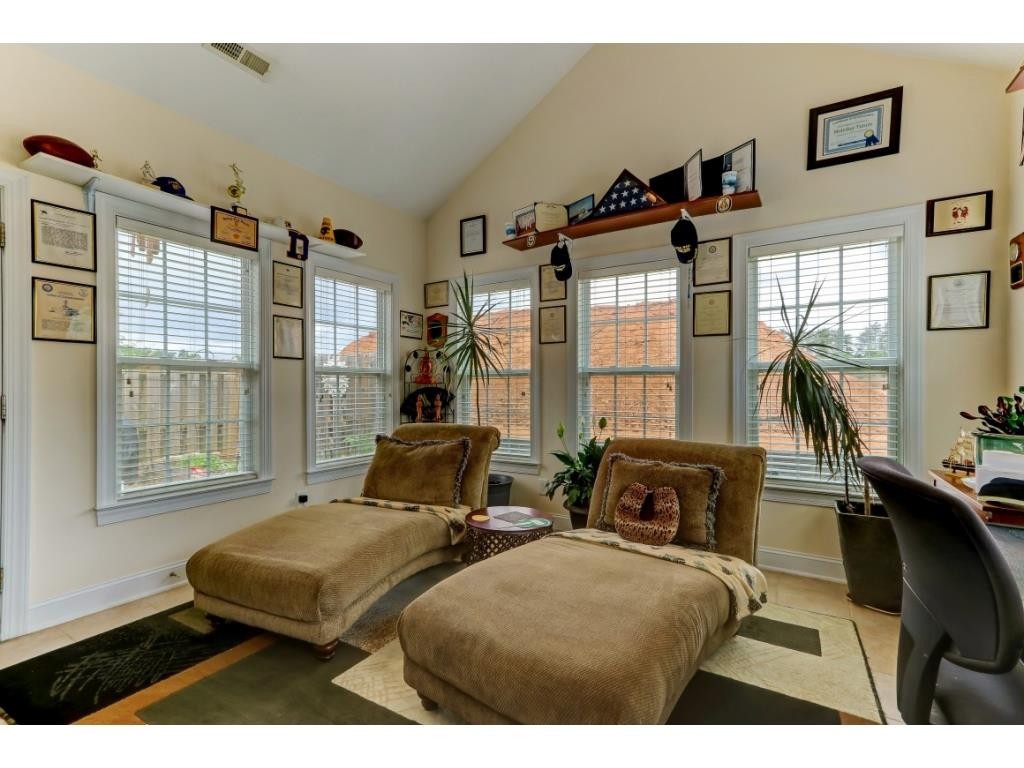 217 Eva Drive Gibsonville, NC 27249 - Photo 13 of 24 a bedroom with furniture and a window