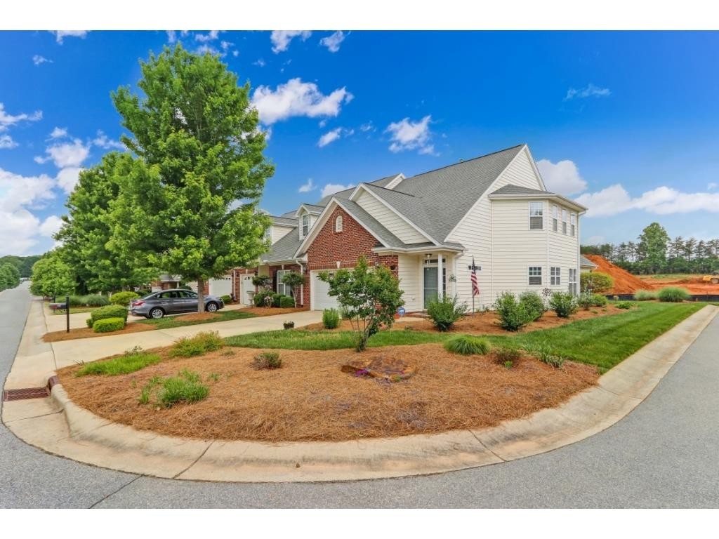 217 Eva Drive Gibsonville, NC 27249 - Photo 2 of 24 a view of a house with a yard