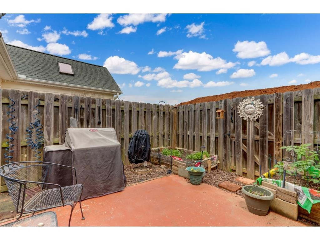 217 Eva Drive Gibsonville, NC 27249 - Photo 22 of 24 a view of a chairs and tables in the patio