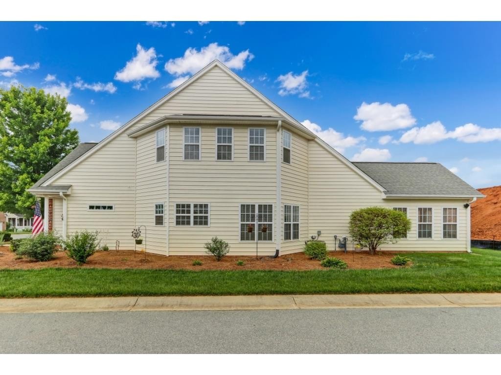 217 Eva Drive Gibsonville, NC 27249 - Photo 24 of 24 a front view of a house with a yard