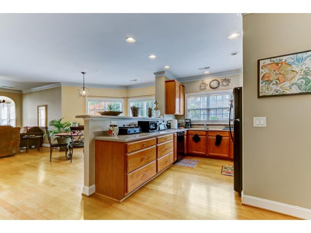 217 Eva Drive Gibsonville, NC 27249 - Photo 5 of 24 a large kitchen with stainless steel appliances lots of counter top space