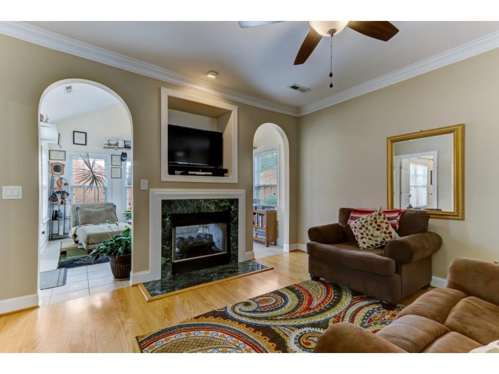 217 Eva Drive Gibsonville, NC 27249 - Photo 10 of 24 a living room with furniture and a fireplace