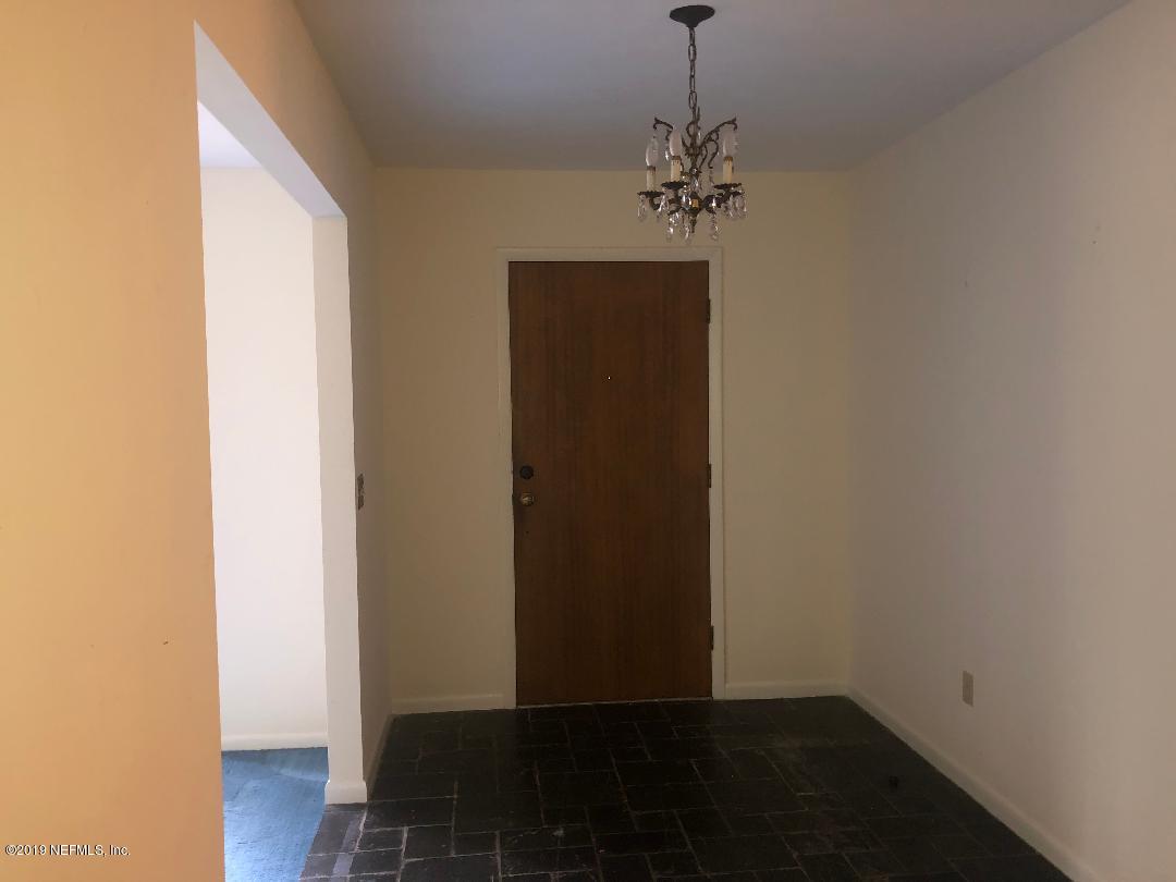 45142 Stratton Road Callahan, FL 32011 - Photo 22 of 29 a view of a hallway with wooden floor